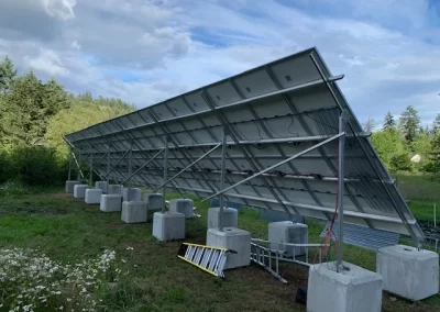rear view of ground mounted array of solar panels